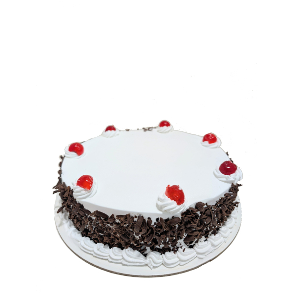 Black Forest cake with whipped cream topping, chocolate shavings on the sides, and red glazed cherries.