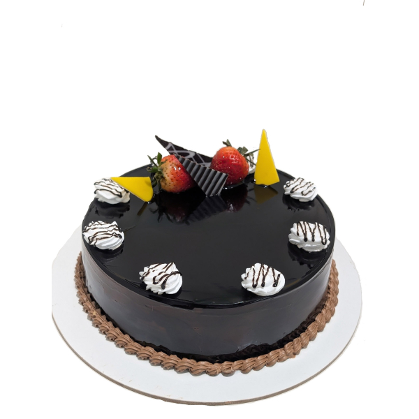 Round chocolate cake with mirror glaze, topped with strawberries, whipped cream, and chocolate decorations