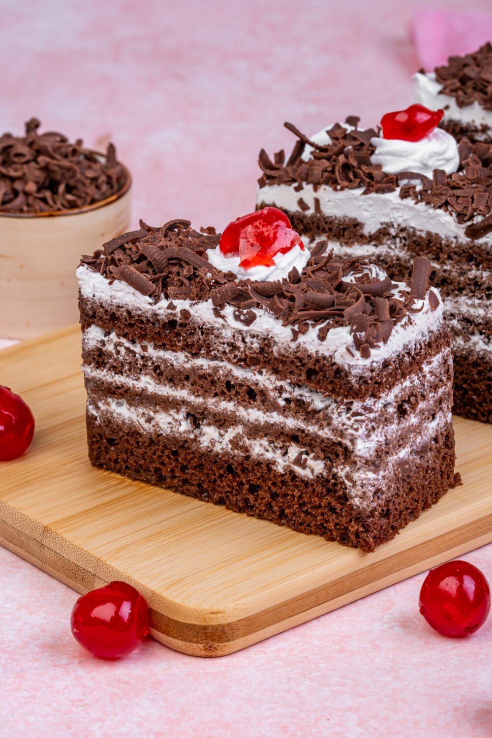 Black Forest Pastry Slice – Winny’s Dubai Chocolate Black Forest pastry slice with whipped cream, chocolate shavings, and cherry on top