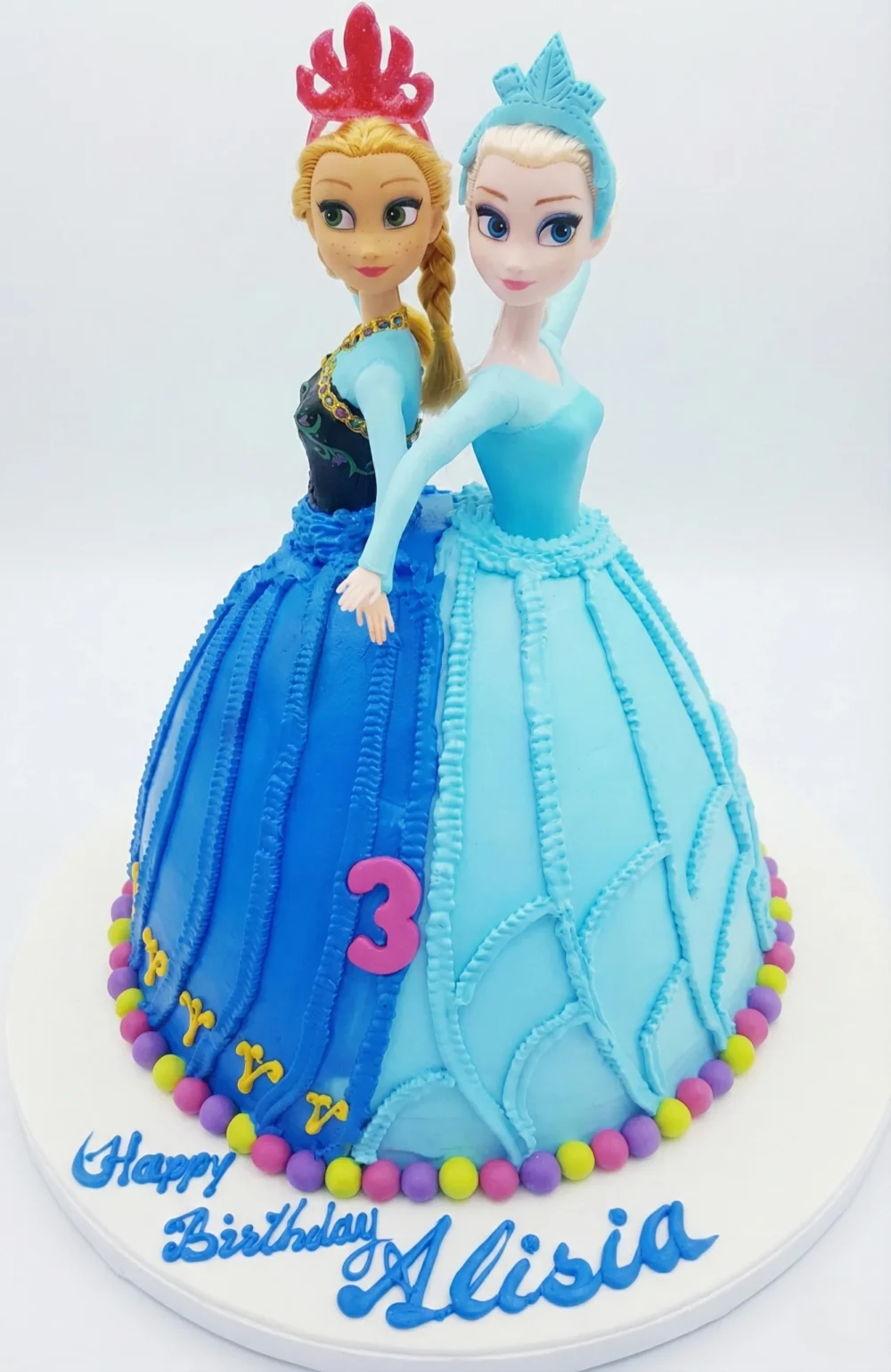Frozen Theme Cake Elsa Anna blue princesses Frozen theme birthday cake with blue icing and two character figurine toppers