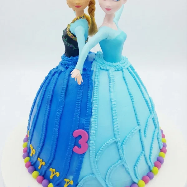 Frozen theme birthday cake with blue icing and two character figurine toppers